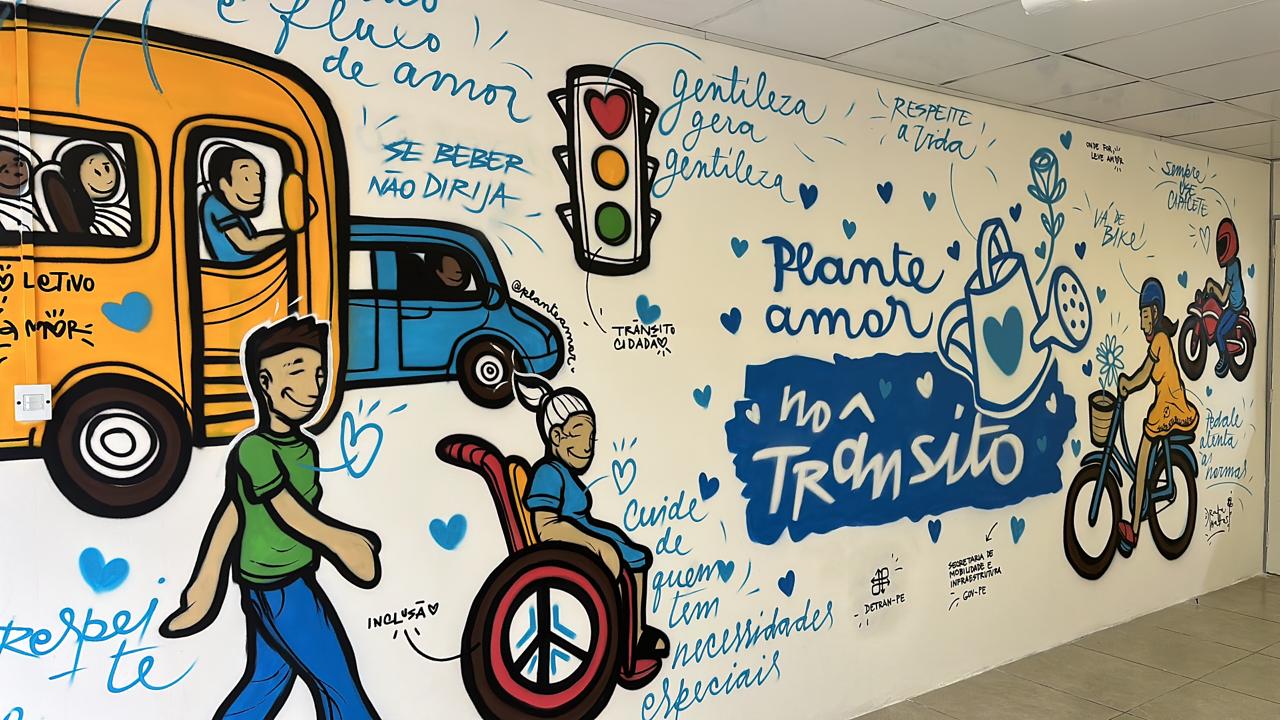 Foto colorida de mural grafitado com a frase 